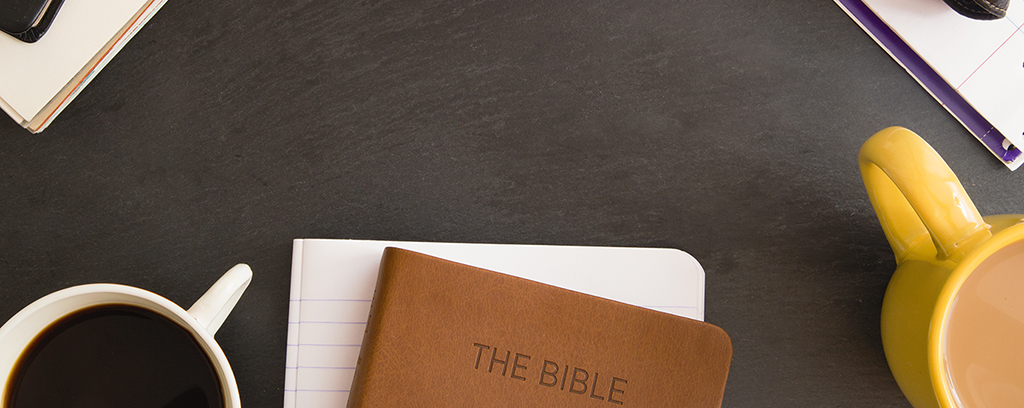 great preaching image of the bible on a table with two coffee mugs and notebook