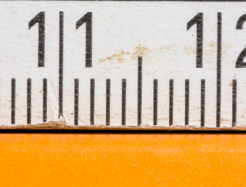 Measuring tape with orange background